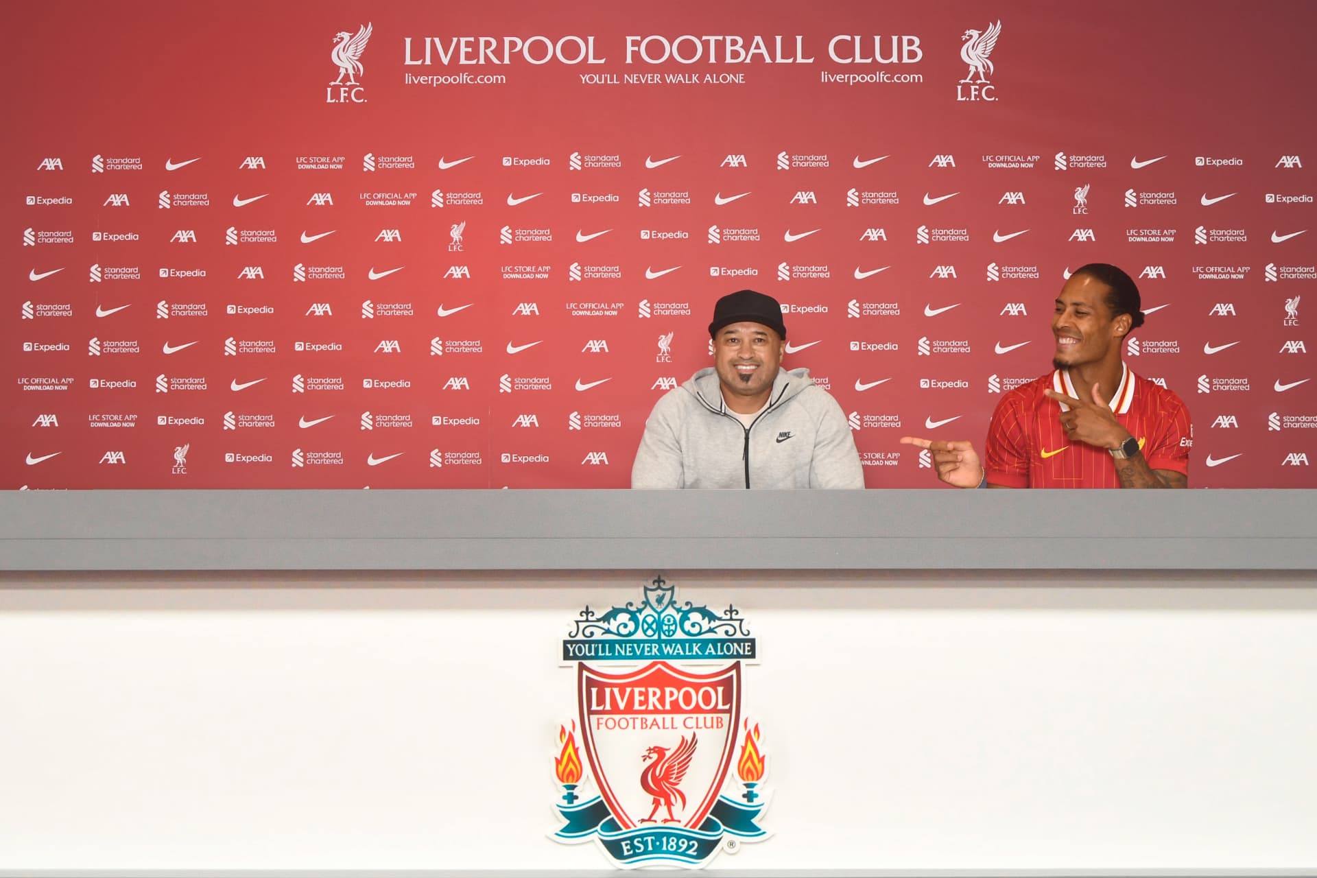 Founder Calvin Francis in the Liverpool FC press room with Virgil van Dijk