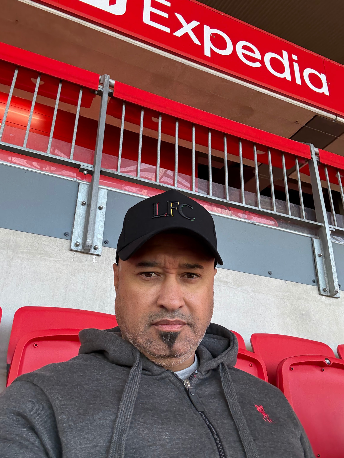Calvin Francis, founder of KOPX, seated in the Anfield stands
