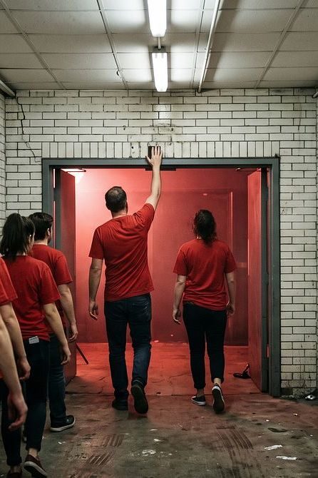 Low ceiling, white brick, red light ahead. You'll want to touch the wall.
